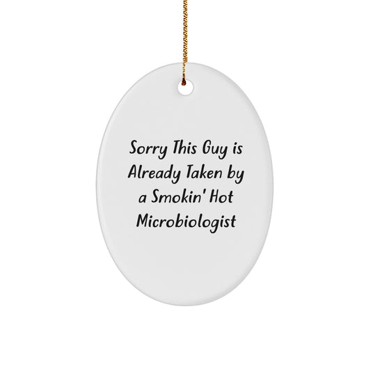 Funny Microbiologist Gifts from Friends, Christmas Unique Oval Ornaments for Microbiologist, Sorry This Guy Is Already Taken By A Smokin' Hot Microbiologist - Image 1